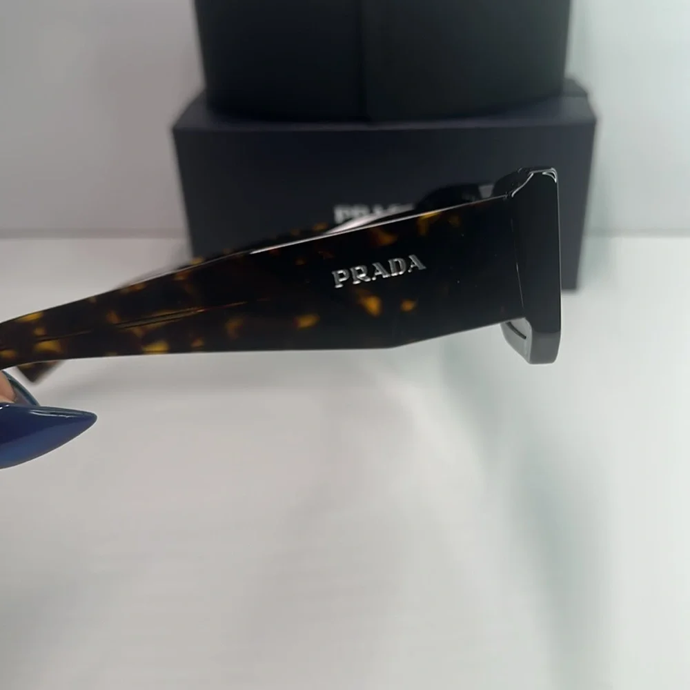Prada PR06YS Brown Sunglasses with Bold Frames and UV Protection